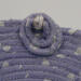 This shows a closeup of the circles with the bead. It also shows some of the frayed raw edges of the fabric adding to its charm. This shows a closeup of the circles with the bead. It also shows some of the frayed raw edges of the fabric adding to its charm.